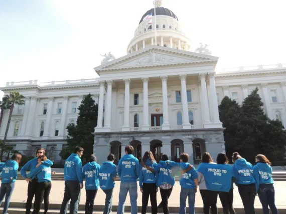 image of ymca youth and government students standing in front of capital building in Sacramento