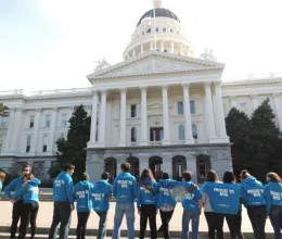 image of ymca youth and government students standing in front of capital building in Sacramento